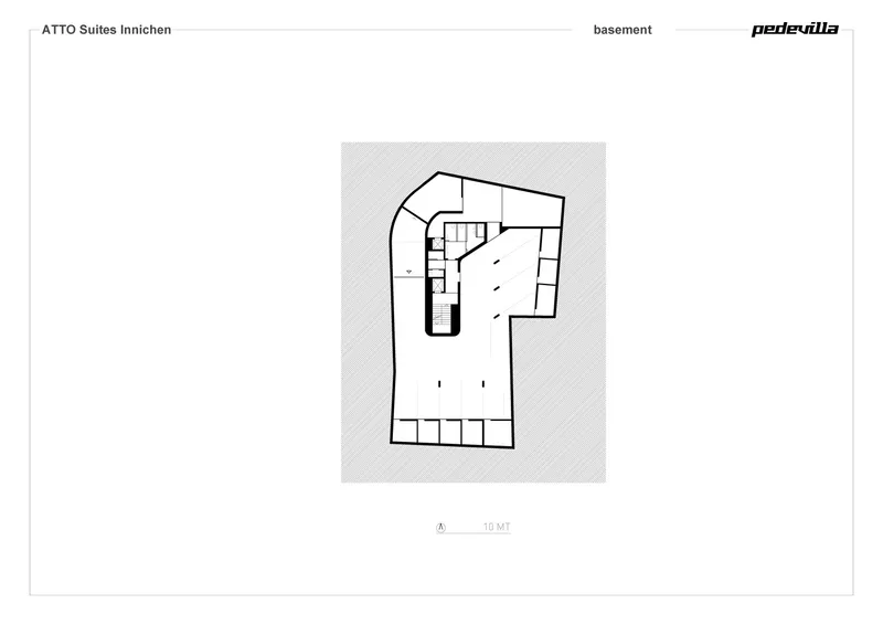 Basement floor plan drawing showing a parking area and curved stair core