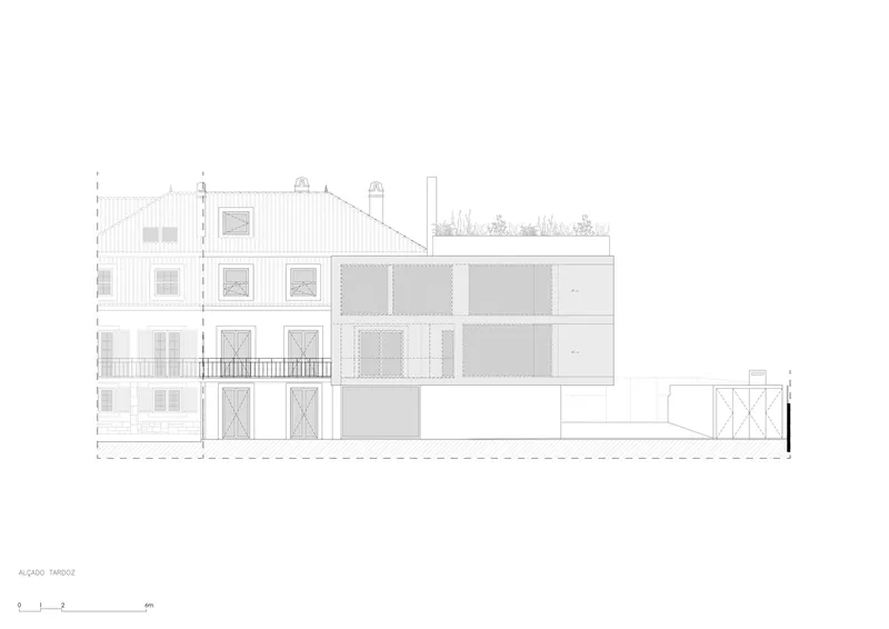Rear elevation drawing showing a multi-story historic volume adjoining a rectilinear extension