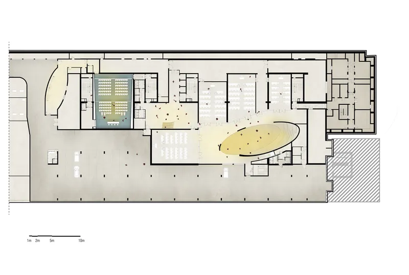 Floor plan showing auditorium seating, foyer spaces, and support rooms with hatched exterior areas