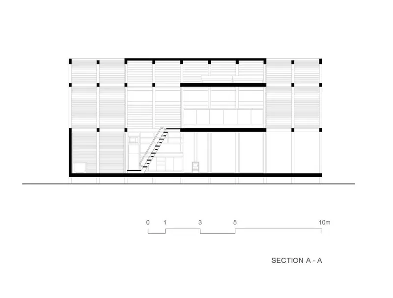 Section drawing showing three-story interior with staircase and horizontal cladding on the facade