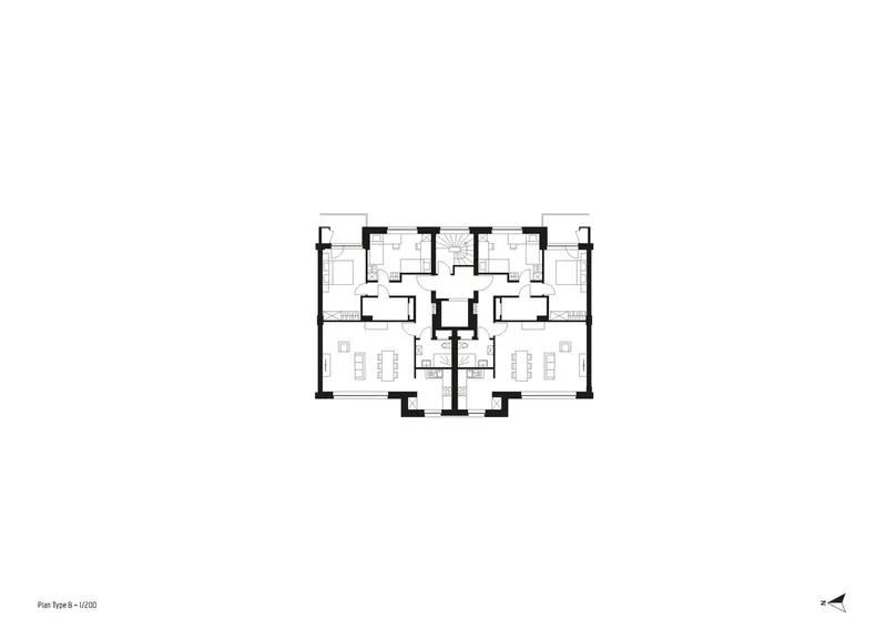 Floor plan drawing showing two mirrored residential units flanking a central circulation core with stairs