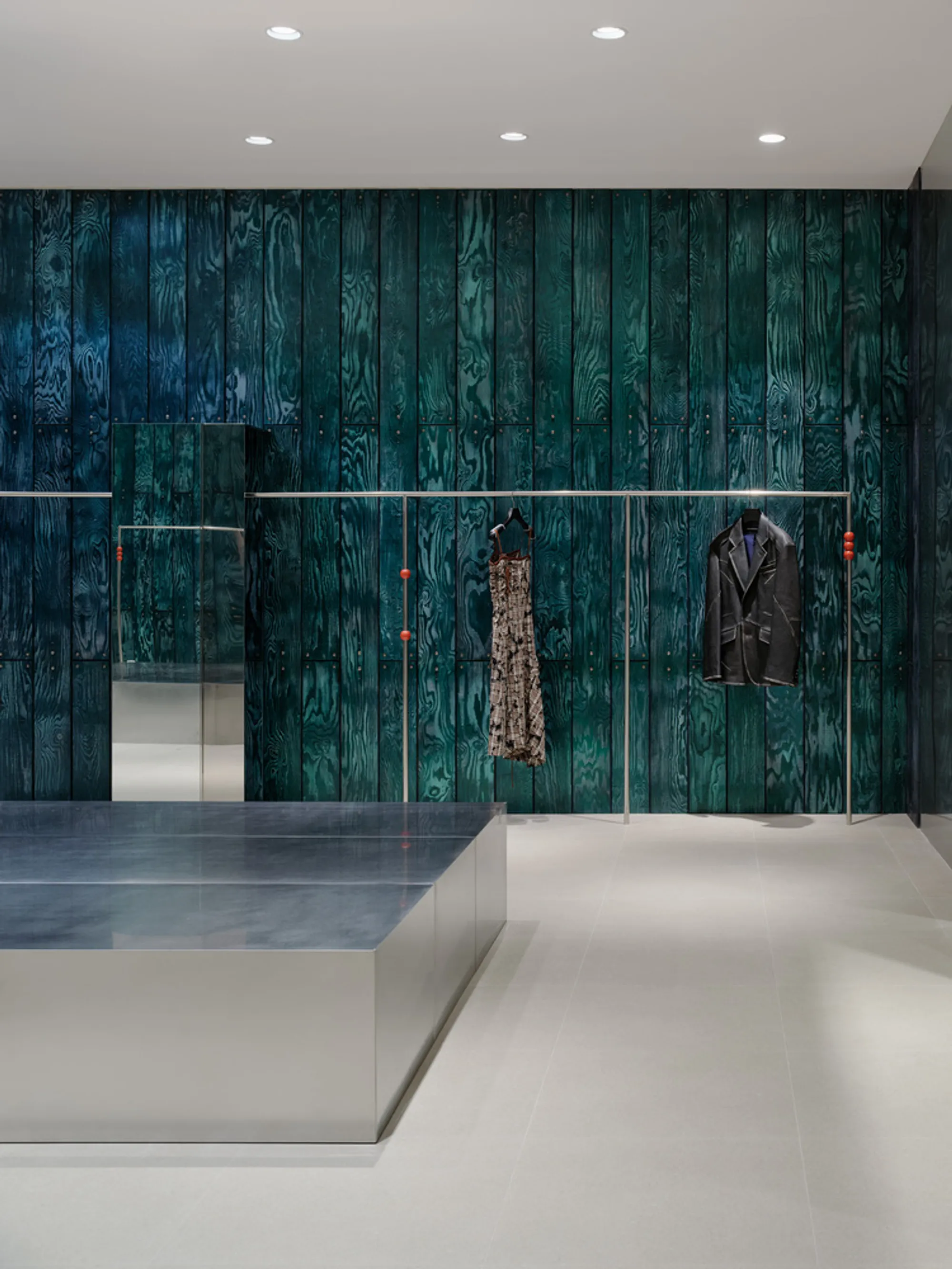 Studio Tama Wraps a Pangyo Fashion Store in Chameleon Wood and Chrome