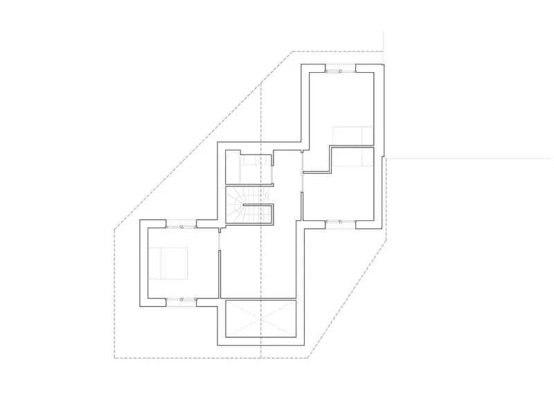 Floor plan drawing showing an irregular polygonal footprint with multiple interconnected rooms and a central staircase