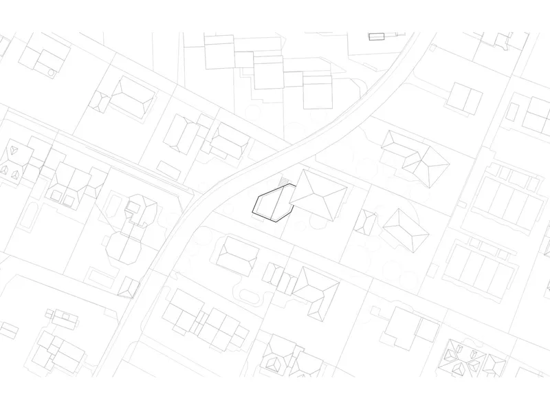 Site plan drawing showing residential buildings arranged along curving streets in a neighborhood context