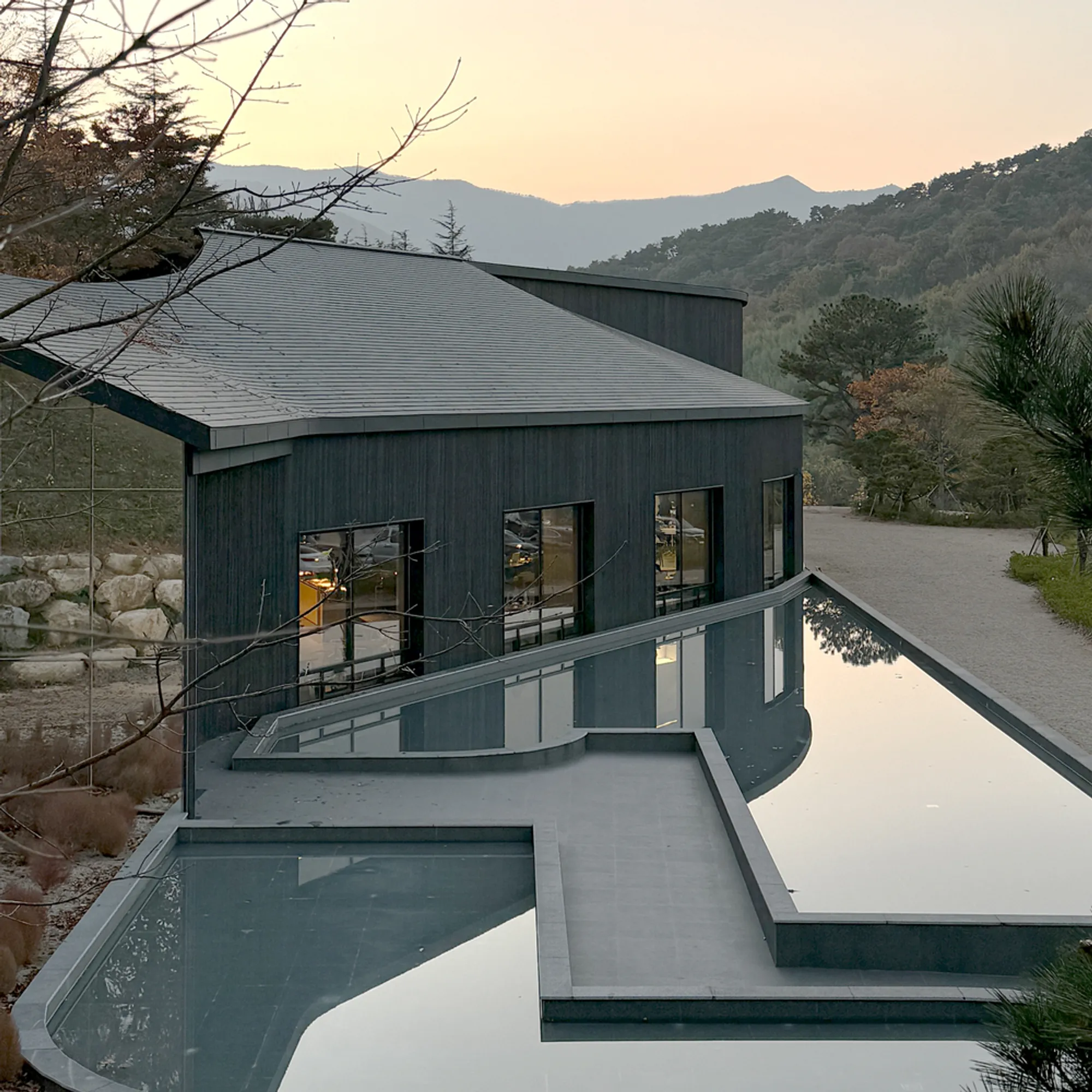 USER and NAUxLab Clad a Fire-Scarred Korean Hillside in 800 Square Meters of Charred Wood