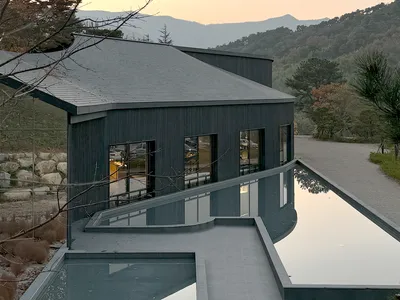 USER and NAUxLab Clad a Fire-Scarred Korean Hillside in 800 Square Meters of Charred Wood