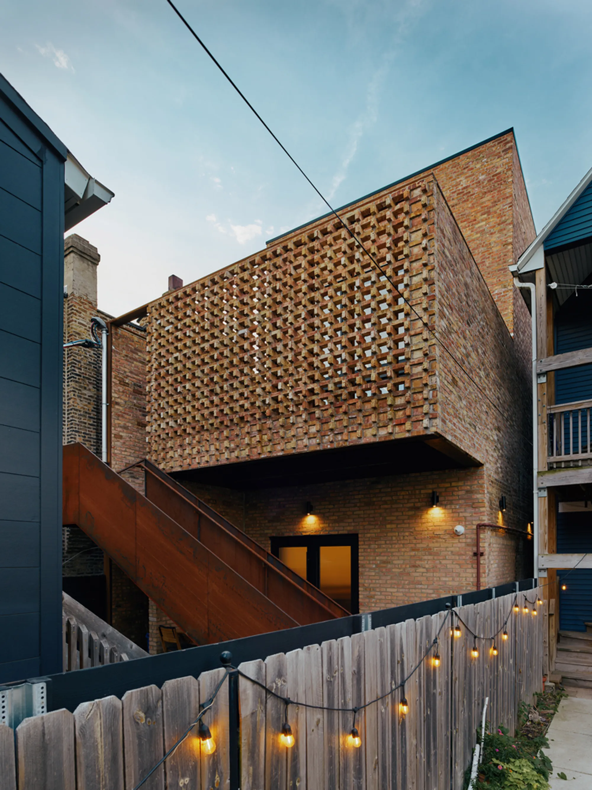 Range Design & Architecture Wraps a Chicago Furniture Studio in a Porous Brick Veil