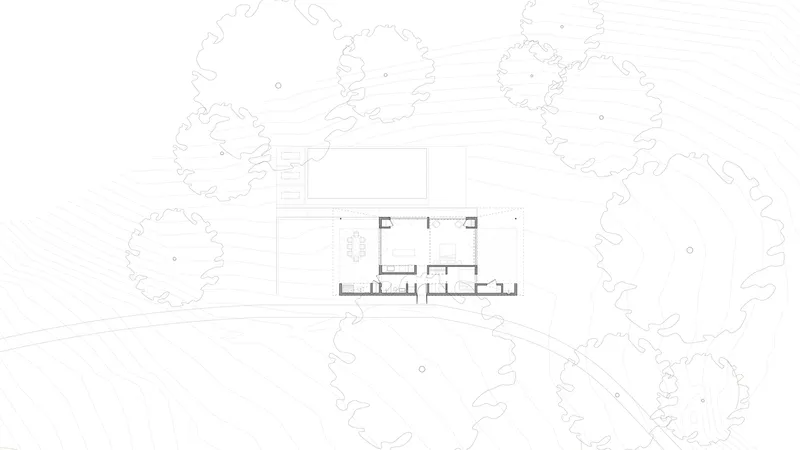 Floor plan drawing with surrounding tree canopies and entry drive depicted in line work