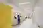 This architectural photograph showcases the interior of a modern hospital, featuring a clean and min