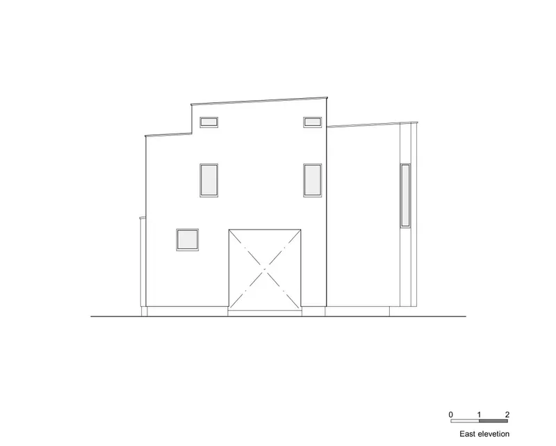 East elevation drawing displaying a facade with scattered square windows and a central crossed opening