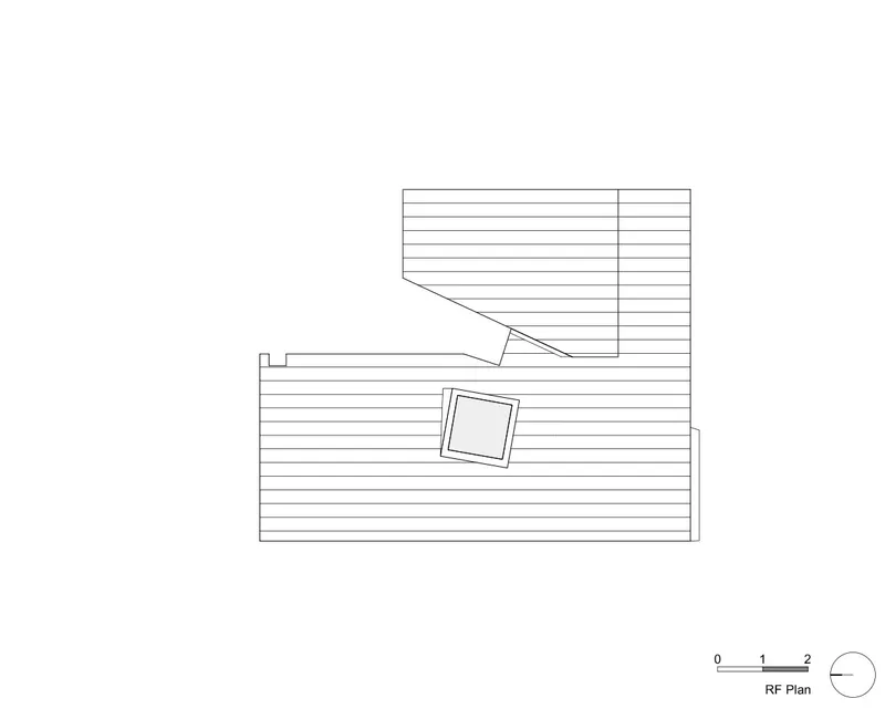 Roof plan drawing showing two offset rectangular volumes with hatched decking and central skylight