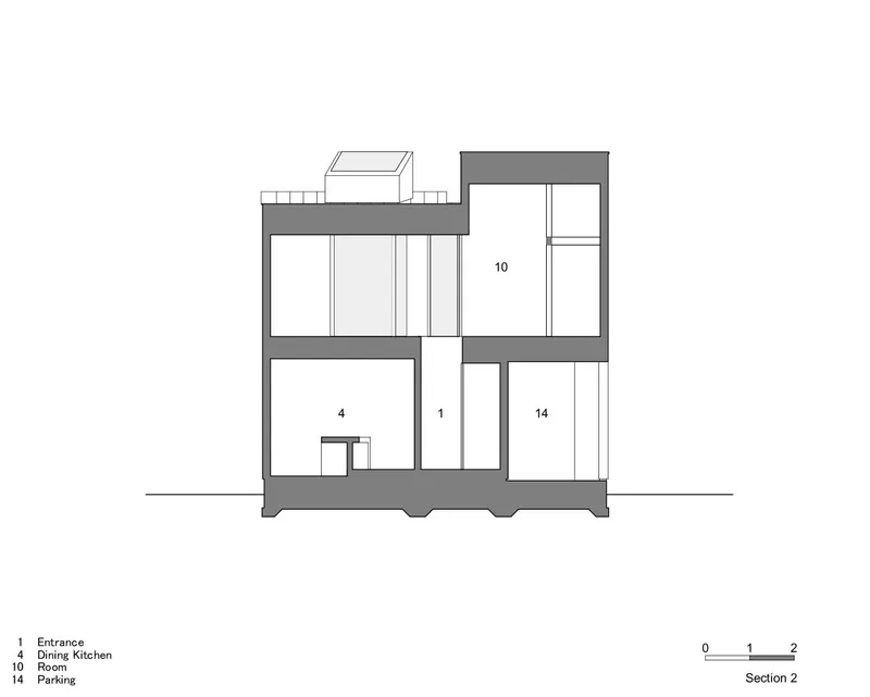 Section drawing revealing vertical circulation connecting entrance, dining kitchen, and parking levels across multiple floors