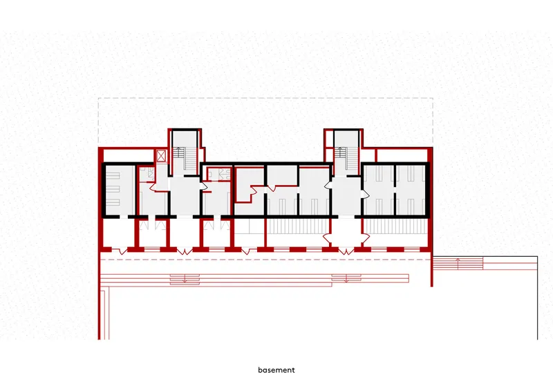 Basement floor plan showing rooms, staircases and structural walls in red and black line work