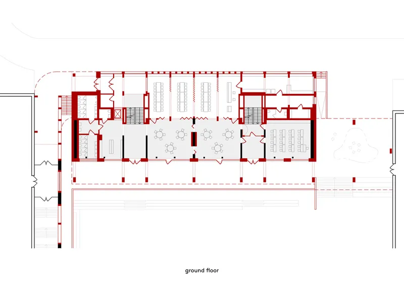 Ground floor plan drawing showing central circulation with flanking rooms and dual staircases