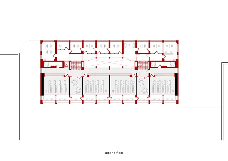 Second floor plan drawing showing repeating cellular offices along a central spine