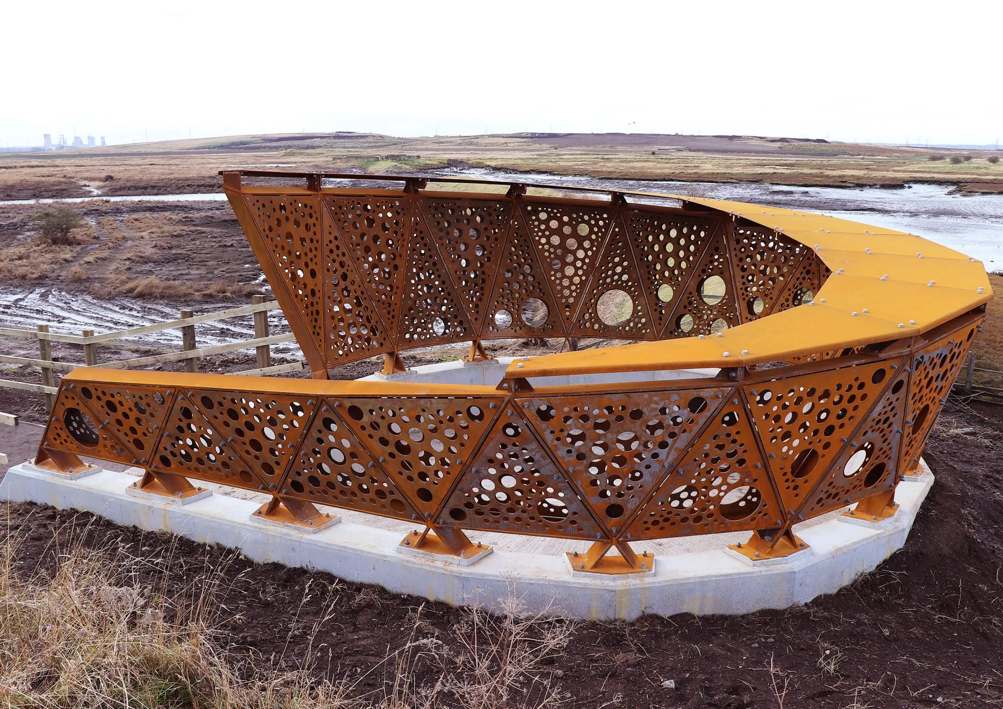Greatham Creek Seal Hide: Weathered Steel Screens Frame a Recovering Wetland