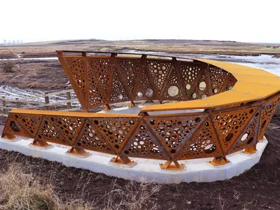 Greatham Creek Seal Hide: Weathered Steel Screens Frame a Recovering Wetland