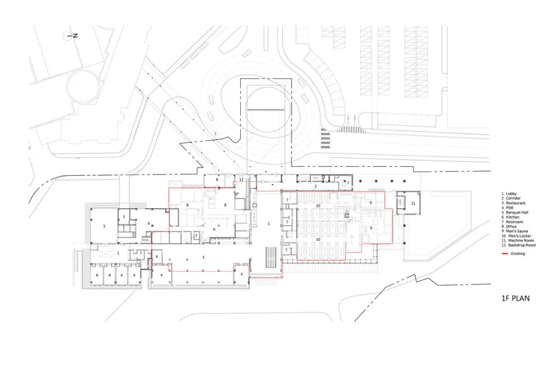 First floor plan drawing with labeled rooms and a curved drive approach adjacent to parking rows