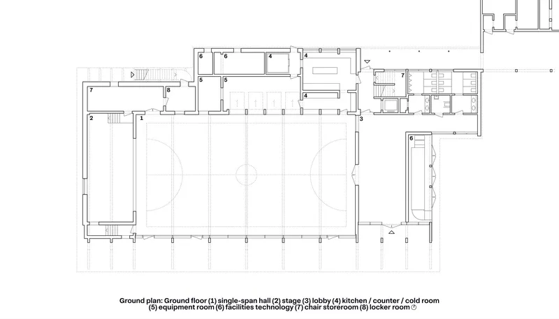 Ground floor plan showing a large hall flanked by support spaces and service rooms