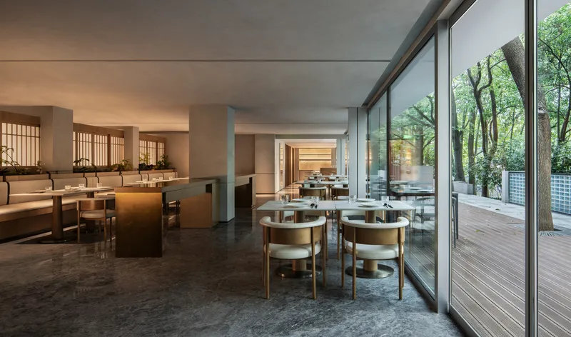Open dining space with timber lattice screens and glazed walls opening to exterior deck
