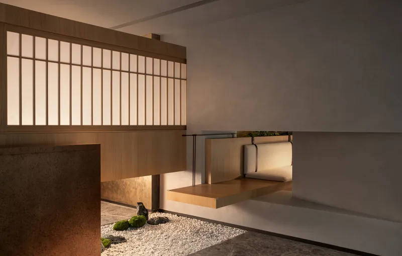 Internal courtyard with white gravel, timber screen wall, translucent vertical slats, and stepping platforms at dusk