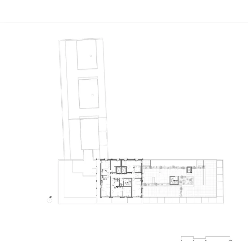 Upper level floor plan drawing showing L-shaped building with corridor access and planted terrace zones