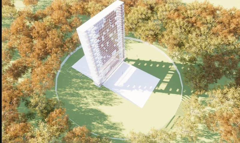 Aerial view of the slender tower with grid facade set within a circular clearing surrounded by autumn trees