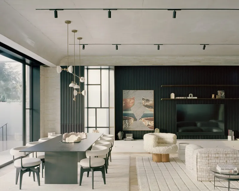 Open-plan living and dining space with dark vertical slat wall and pale timber flooring