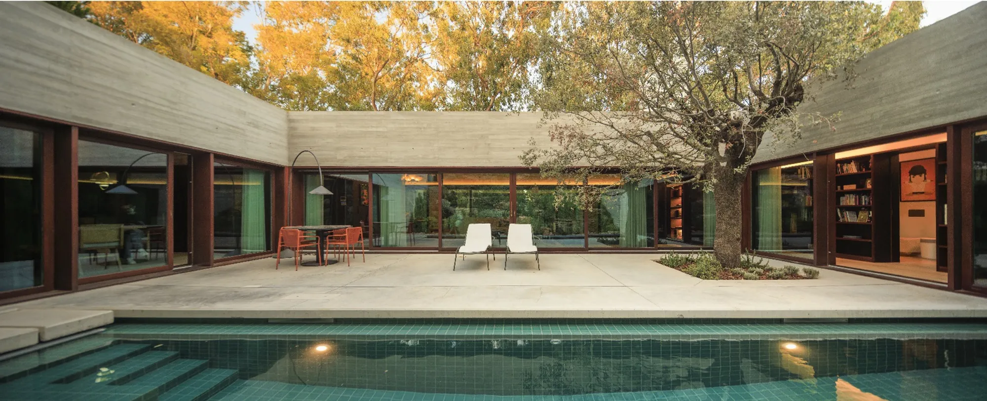 OODA Buries a Concrete House into a Portuguese Hillside to Save Its Century-Old Pines