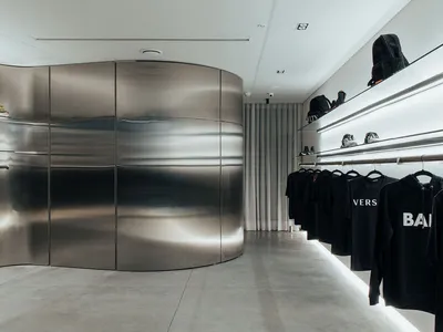 Boo Studio Wraps a Trapezoidal Medellín Boutique in a Continuous Steel Shell