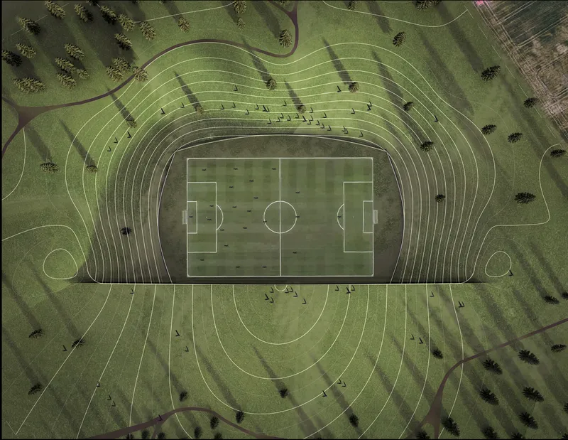 Aerial view of the football pitch surrounded by concentric terraced seating carved into the grassy landscape