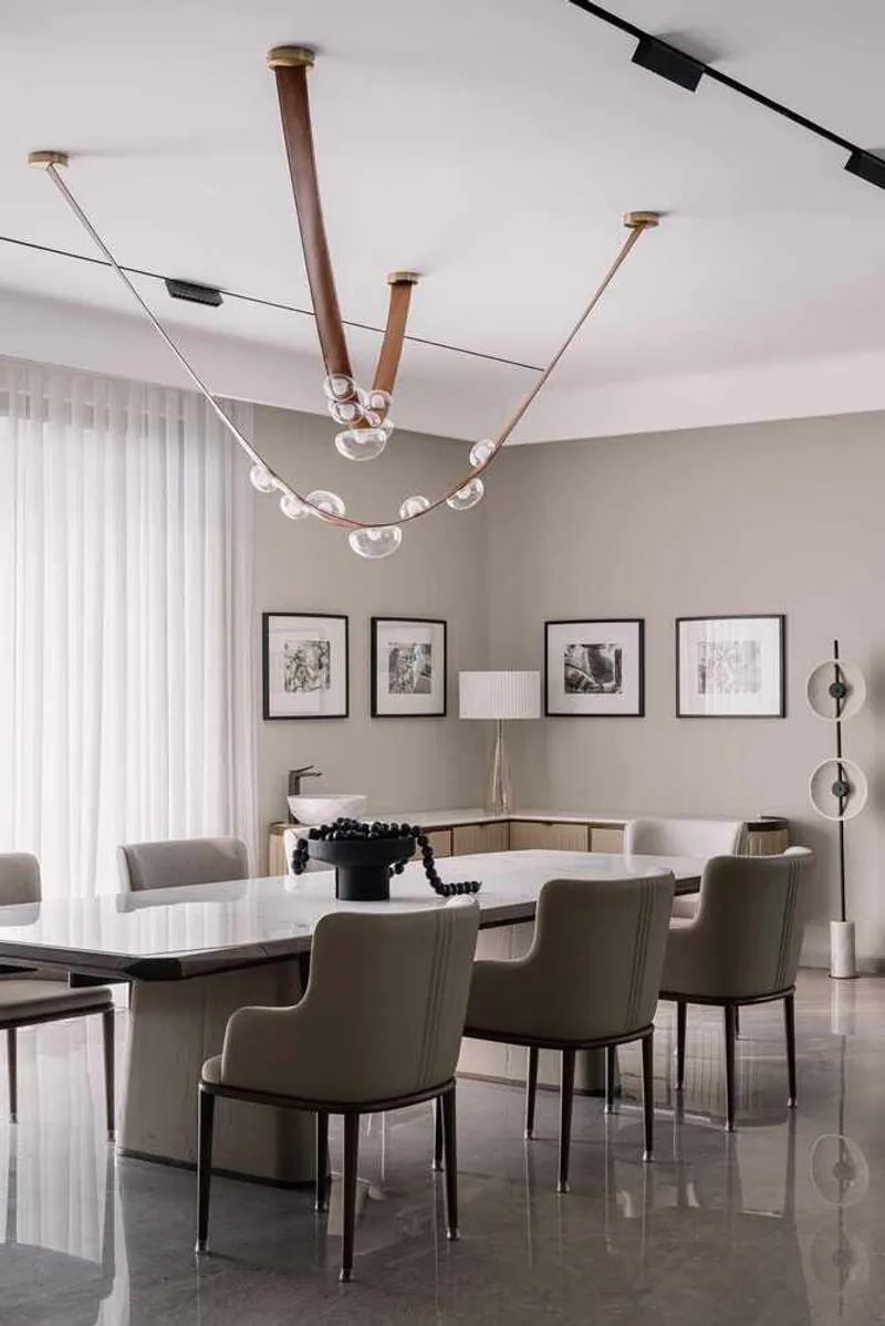 Dining room with custom light fixture featuring copper rods and glass globes suspended from the ceiling