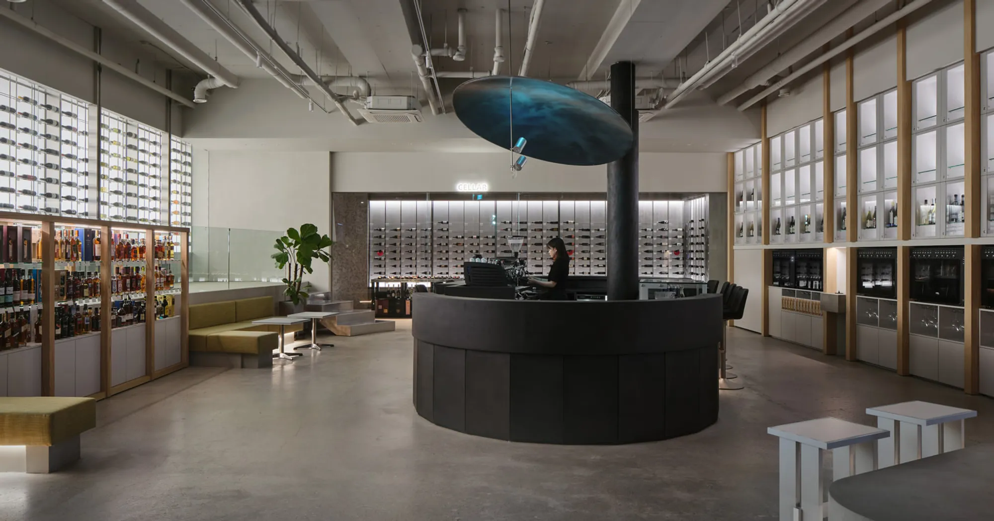 Studio Prepro Wraps a Circular Bar in Black Concrete to Anchor Seoul's Winenara Wine Hub