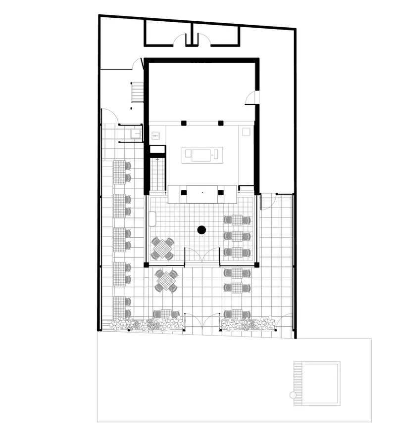 Floor plan drawing showing a large paved courtyard with seating arrangements and adjacent interior rooms with staircase