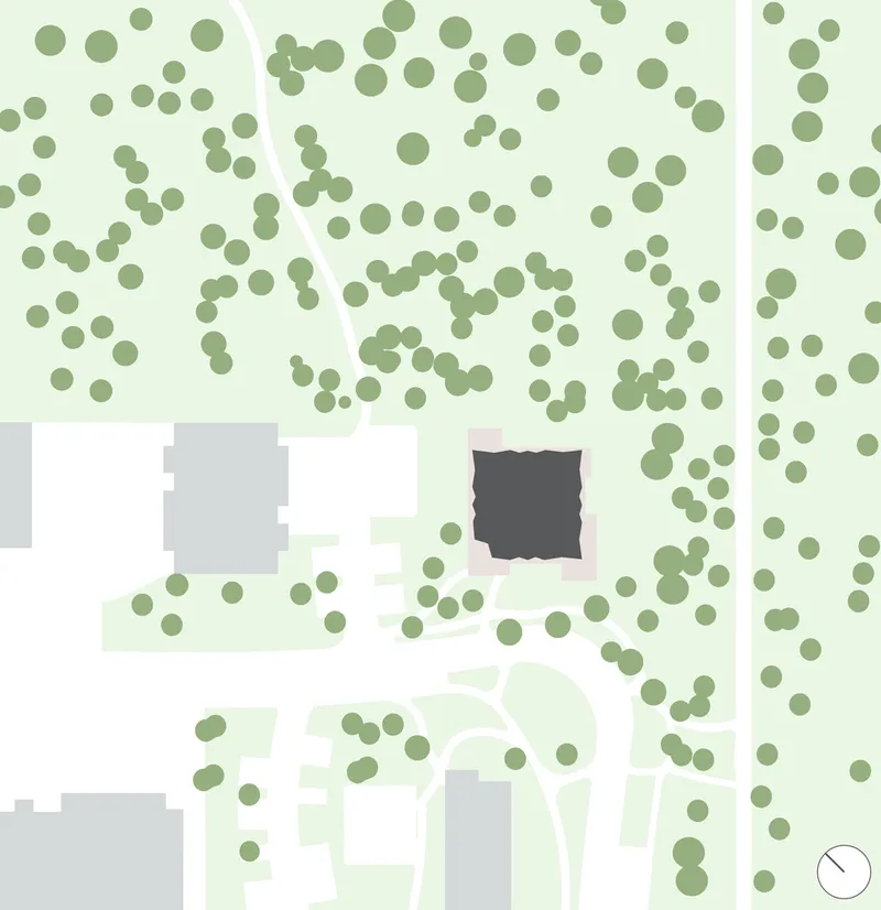 Site plan drawing indicating building footprint surrounded by circular tree symbols and adjacent structures