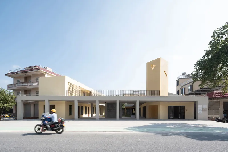 Street view of the elevated structure on concrete columns as a motorcyclist passes by