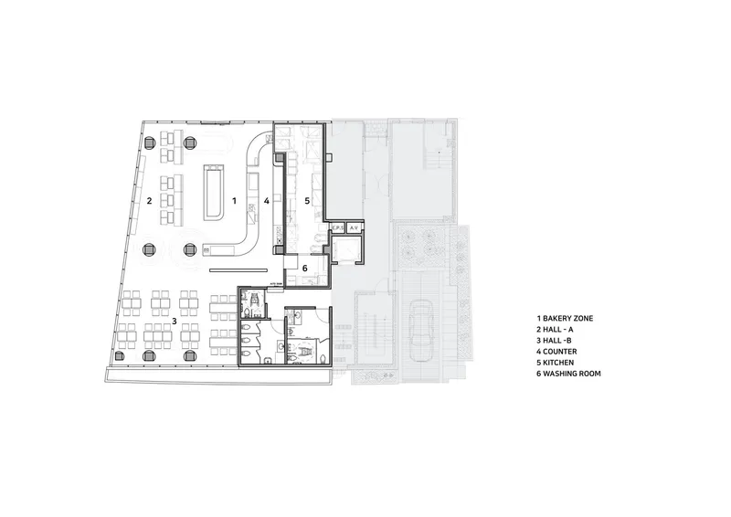 Floor plan drawing showing the bakery zone, seating area, kitchen and service rooms with exterior courtyard
