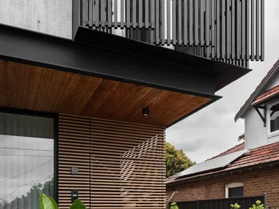 Studio Parisi Architects Wraps a Brutalist Suburban House in Timber, Concrete, and Green Defiance