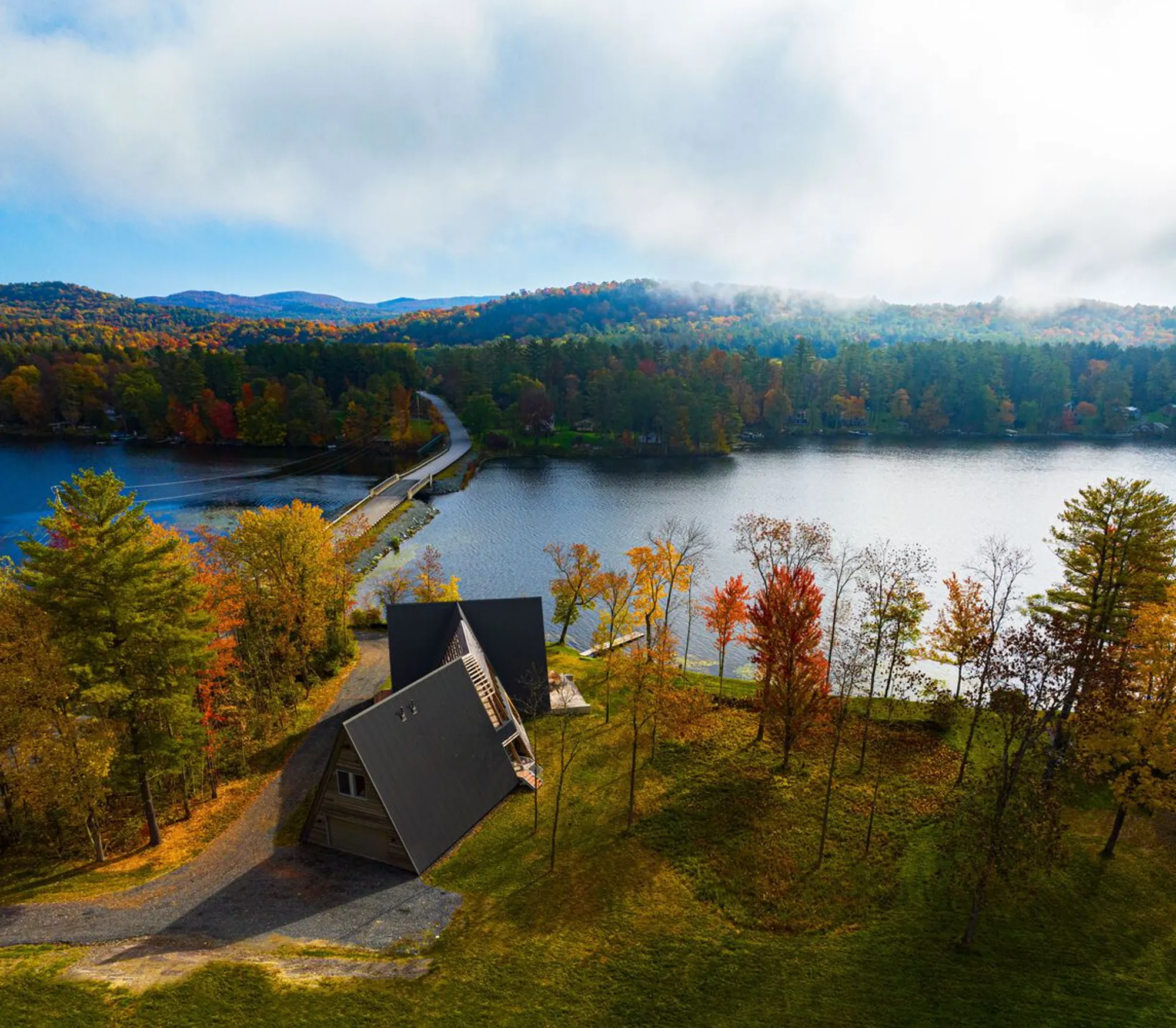 Birdseye Weaves Three A-Frames Together on a Vermont Lakefront