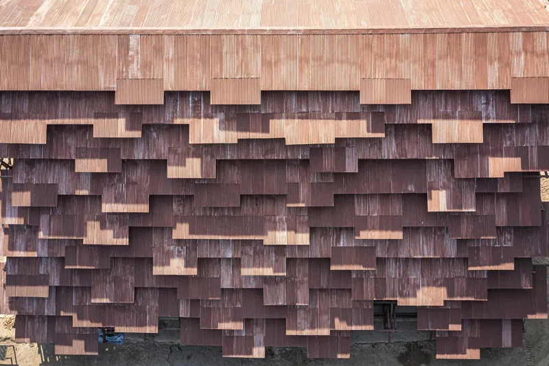 Stepped copper cladding pattern creating a textured facade with varying panel depths