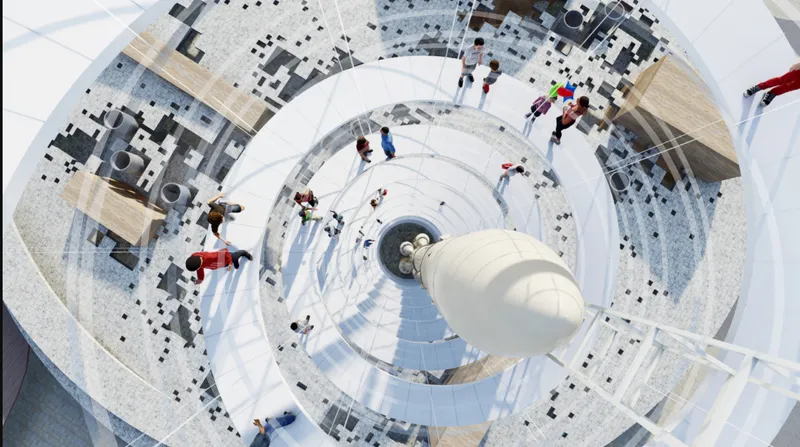 Top-down view into the spiral tower showing concentric rings of paving, visitors, and a suspended rocket