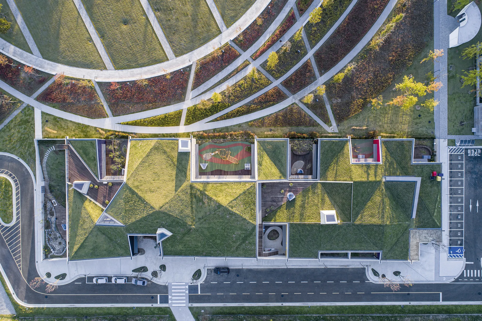ISON Architects Disguises an 18-Room Daycare as an Inhabitable Hillside in Incheon