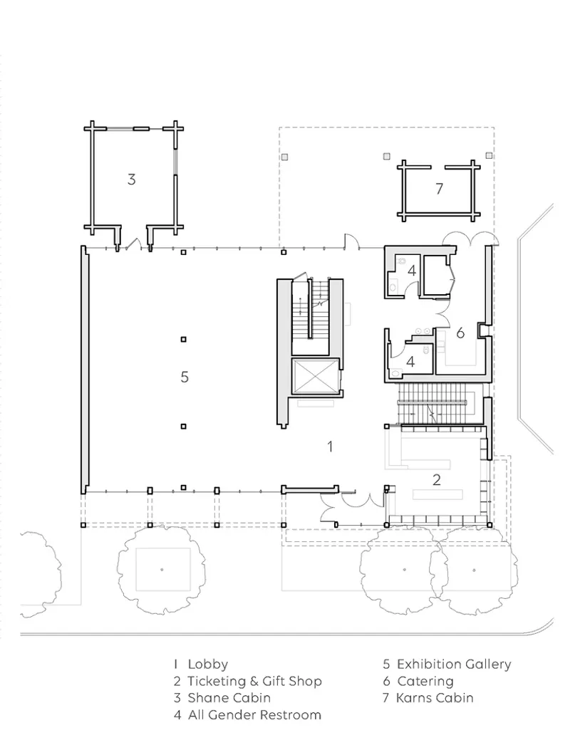 Ground floor plan drawing showing lobby, ticketing shop, exhibition gallery, catering and cabin spaces with surrounding trees