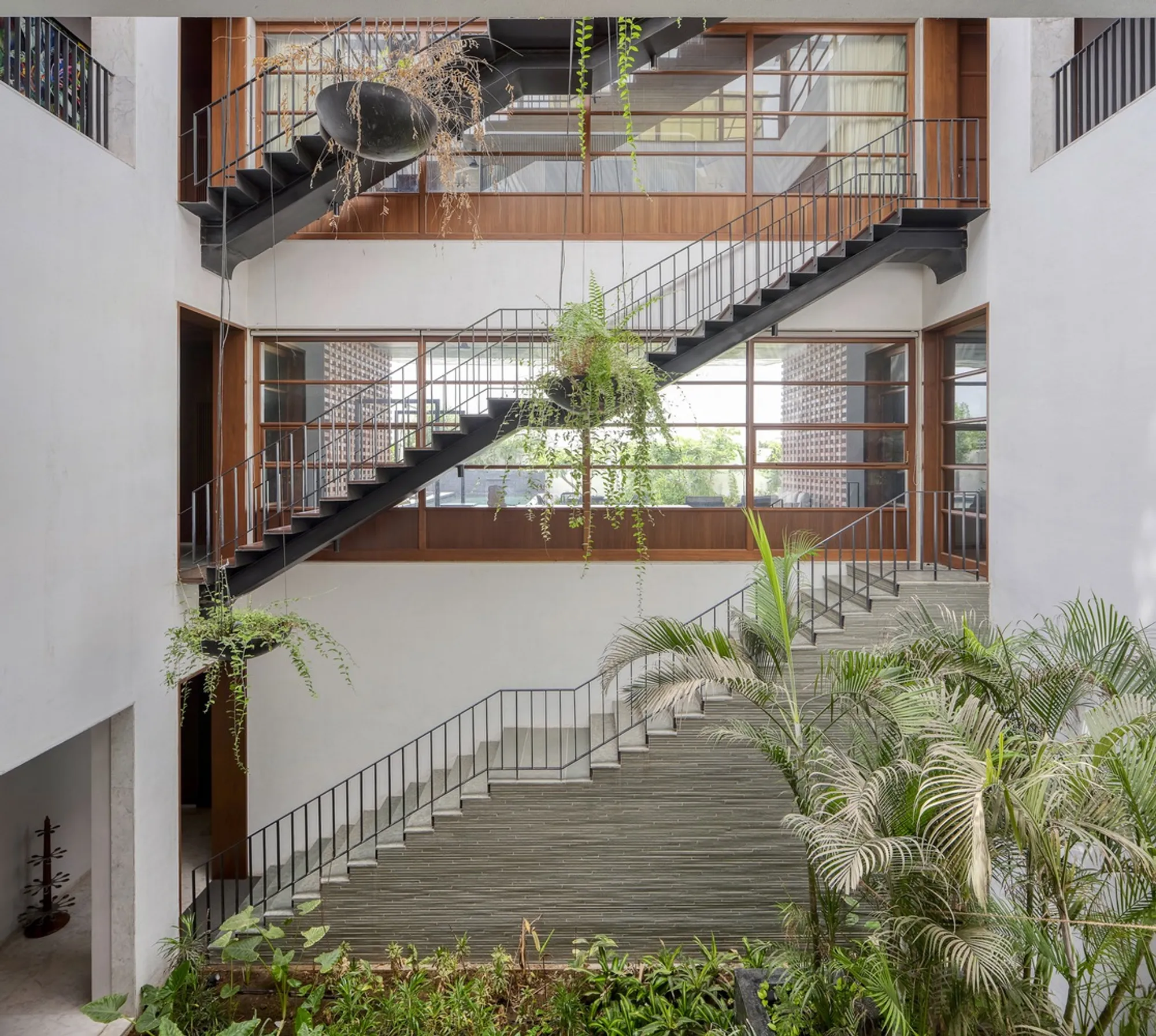 SPASM Design Wraps a Multigenerational Ahmedabad Home in a Vertical Brick Jaali Veil