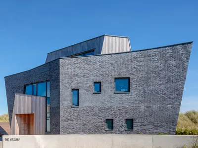 CZWG Architects Sculpt a Salt-Glazed Brick House into the Dunes at Greatstone-on-Sea