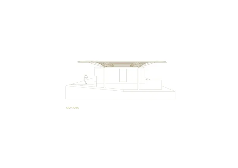 East elevation drawing revealing a cantilevered roof overhang above a minimal glazed facade and raised plinth