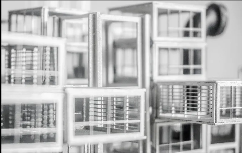 Close-up of the model detail revealing layered window frames and horizontal louvered elements