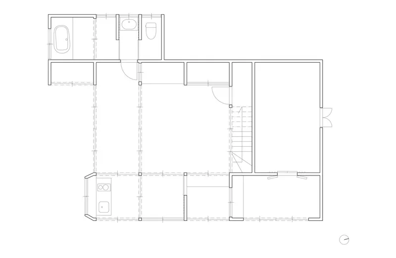 Ground floor plan drawing showing bathroom cluster, kitchen alcove and open living area