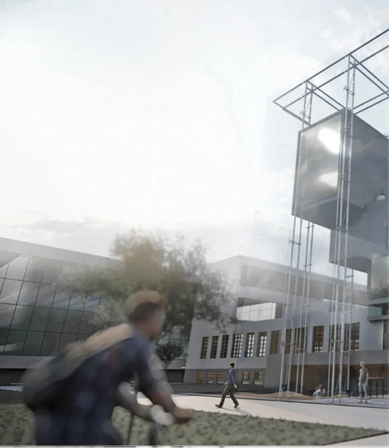 Street level view of the steel frame canopy with pedestrians walking near mature trees