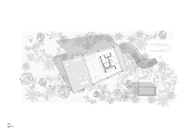 Site plan drawing showing rectangular building surrounded by trees and planting with car parking